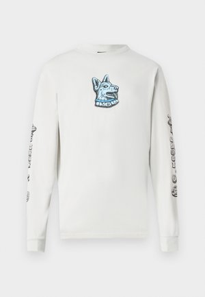 White long-sleeve t-shirt featuring a blue embroidered dog design on the chest and graphic details on both sleeves. Soft cotton fabric.