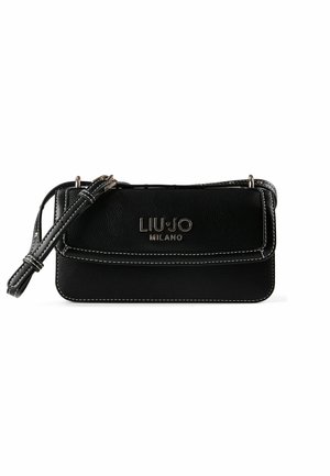 Black leather handbag with white stitching. Features a front flap, embossed logo, and a detachable strap. Compact rectangular shape.
