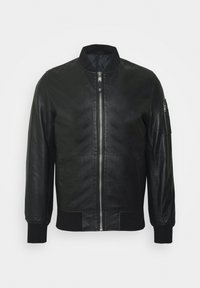Blouson aviateur en cuir noir avec fermeture zippée devant, poignets et col côtelés. Doté d'une poche latérale zippée. Texture lisse.