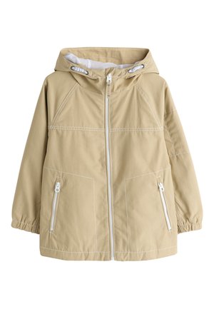 Beige jas met capuchon, ritssluiting aan de voorkant en twee met rits gesloten zakken, elastische boorden en witte contrasterende stikseldetails.