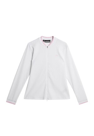 Vit långärmad zip-up jacka med en texturerad mönster, med en rosa krage och manschetter. Diskret logotyp på vänster bröst.