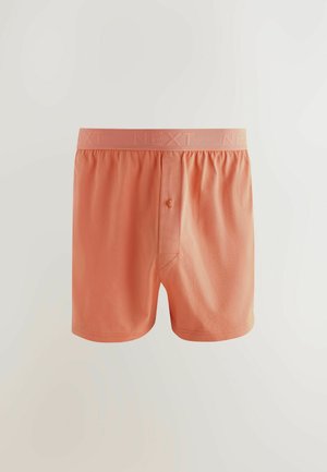 Pfirsichfarbene Boxershorts aus weichem Stoff, mit Knopfverschluss, elastischem Bund mit 'NEXT'-Markenaufdruck und lockerer Passform.