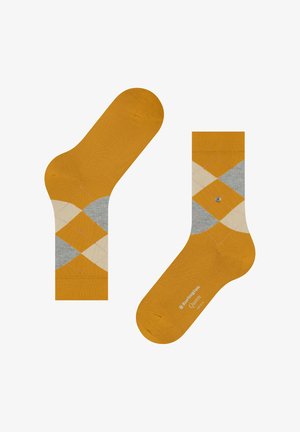 Geel en grijze argyle sokken met een gestructureerd gebreid ontwerp, een gladde afwerking en een enkele grijze knoop als accent.