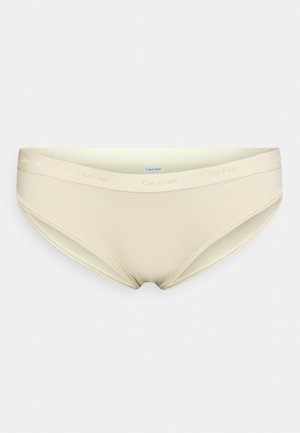 Cuecas de bikini em mistura de algodão bege com uma textura suave e uma faixa elástica na cintura, apresentando o logótipo "Calvin Klein" em letras subtis.