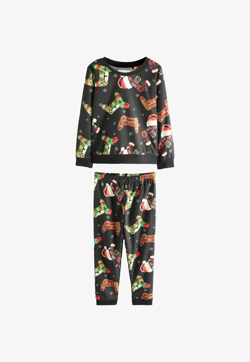 Pitkähihaisesta pyjama-asusta, jonka musta pohja on koristeltu värikkäillä kuvioilla, kuten joulupukin hatuilla, karkkitangoilla ja peliohjaimilla. Materiaali on pehmeää.