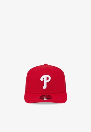 Red baseball cap with white letter "P" on the front, structured crown, flat visor, and adjustable snapback closure.
