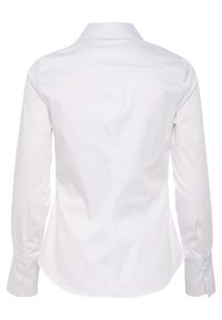 Valkoinen, pitkähihainen, istuva paita nähtynä takaa, jossa on klassinen kaulus ja napilliset kalvosimet.