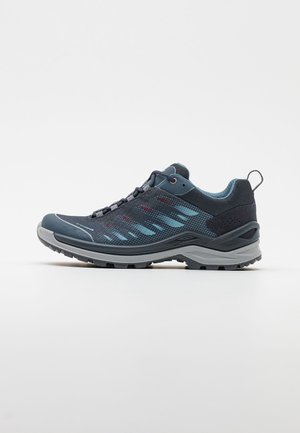 Shoe: lightweight, dark blue mesh upper with lighter blue accents, reinforced toe cap, durable gray sole with multicolor tread pattern.