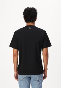 Lacoste Apdrukāts T-krekls - black