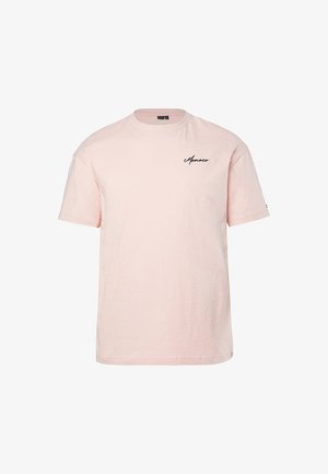 T-shirt in cotone rosa chiaro a maniche corte con scollo tondo e piccola scritta nera "Monaco" sul lato superiore sinistro del petto.