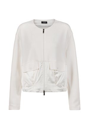 Veste blanche à manches longues avec col rond, fermeture éclair à l'avant, deux poches à rabat et détail à l'ourlet élastiqué.