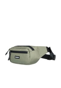 Bandolera de color verde oliva hecha de tejido resistente, con un bolsillo con cremallera en la parte frontal, cremalleras negras y una correa ajustable. Diseño compacto.