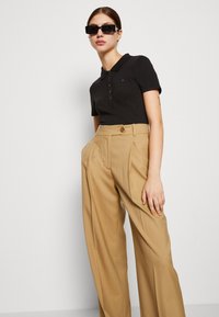 Tommy Hilfiger 1985 SLIM - Polo - black