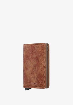 Kompakte braune Lederkartenhalter-Brieftasche mit Metallkante und "SECRID"-Logo, das vorne und an der Seite geprägt ist.