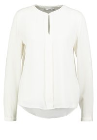 Blouse blanche à manches longues avec un col rond, une ouverture en trou de serrure à l'avant et un ourlet arrondi. Confectionnée dans un tissu lisse et léger.