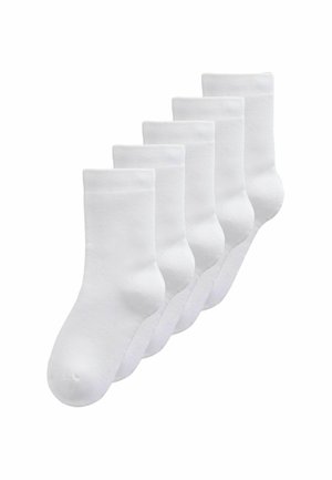Five identical plain white crew socks arranged in a staggered row on a white background.