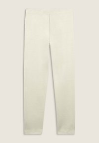 Leggings beige claro con un tejido liso y elástico y una cintura elástica. Presentan un diseño ajustado y una confección sin costuras.