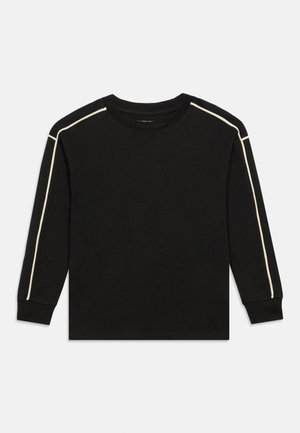 Juodas ilgomis rankovėmis džemperis su kremine apvadais per pečius ir rankoves, apvalia iškirpte ir ribotais rankogaliais.