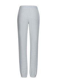 Gaiši pelēkas trenirbikses, izgatavotas no mīksta, strukturēta auduma ar elastīgu jostasvietu un pieguļošām piedurknēm pie potītēm. Vienkāršs un taisns piegriezums.