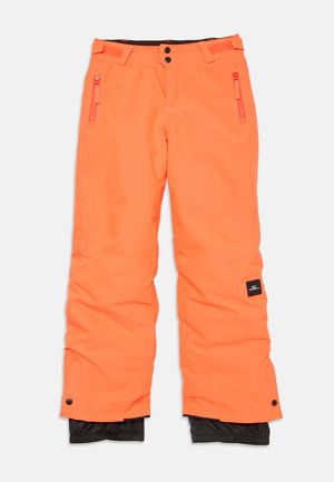 Felle oranje skibroek met ritssluitingen, zwarte binnenvoering en verstelbare manchetten. Gemaakt van een weerbestendig materiaal.