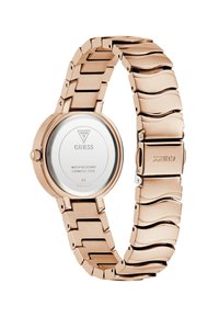 Reloj de acero inoxidable color oro rosa con una caja redonda y una pulsera de eslabones con un patrón de ondas. Presenta una esfera blanca minimalista y el logotipo en la parte posterior.