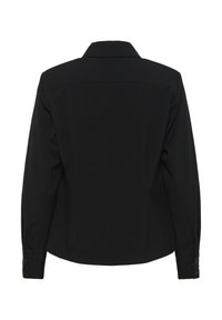 Melnas garām piedurknēm krekls ar struktūrētu apkakli, pogājamiem aprocēm un gludu tekstūru. Aizmugures skats demonstrē tīras līnijas un minimālu detaļu izmantojumu.