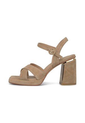 Sandală de damă bej din piele întoarsă, cu toc gros, barete încrucișate căptușite, bretea la gleznă cu cataramă rotundă și accent metalic pe toc.