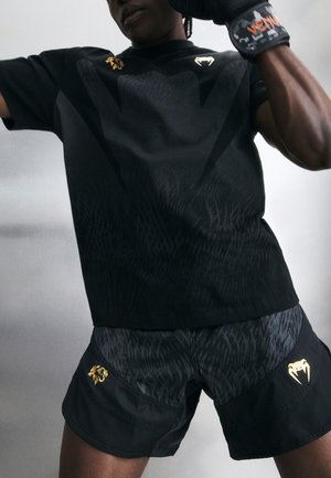 Venum VENUM X CHIMAEV WILD BORZ FIGHTSHORTS - Pantaloni scurți sport - black/grey/gold-coloured