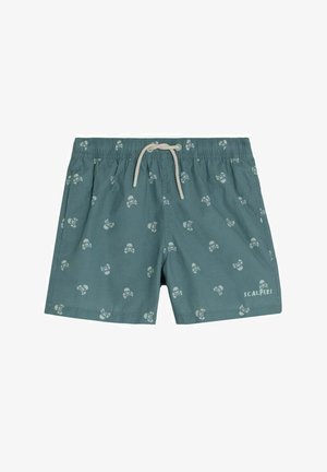 Șorturi de baie de culoare teal cu model alb cu craniu și oase încrucișate, talie elastică, șnur crem și logo-ul "Scalpers" pe piciorul stâng.