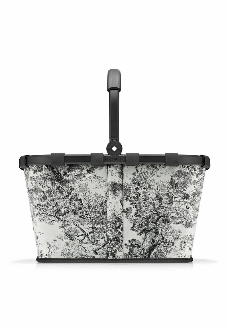 Panier à motifs noir et blanc avec une poignée robuste, fabriqué en tissu et en plastique, présentant un design floral et une forme rectangulaire.