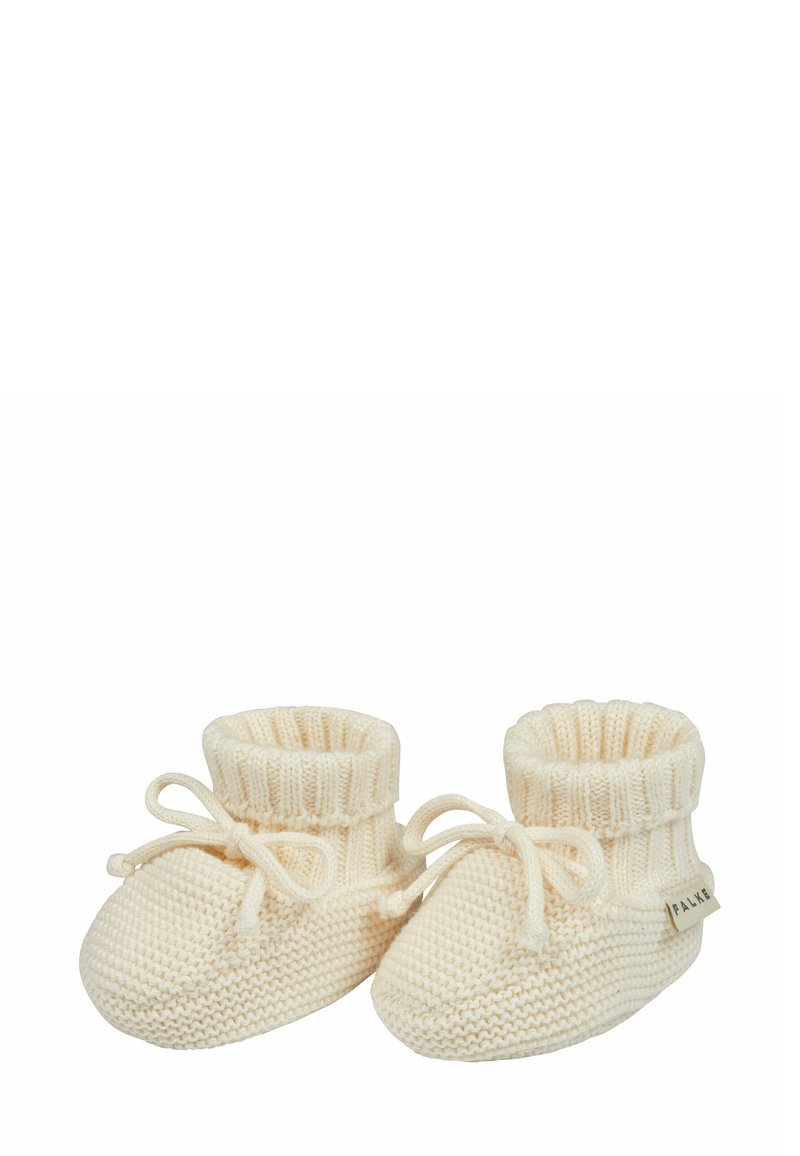 Dziane buciki dla niemowląt w kolorze kremowym, z prążkowym mankietem w okolicy kostki i detalem w postaci kokardki. Miękka faktura, zaokrąglony czubek i mała metka po boku.