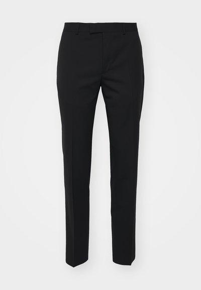 Mustad mustad püksid sirge jala disainiga, valmistatud siledast kangast. Omab eesriideid, libisevaid taskuid ja lapikut vööd.