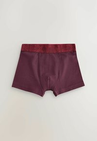 Boxer-briefs bordeaux en tissu doux, avec une ceinture élastique rouge portant la marque "NEXT". Design ajusté et texture lisse.