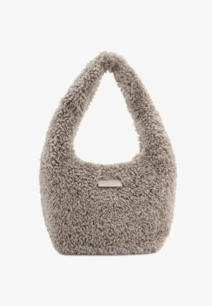 Fuzzy beige handbag with a rounded top and a short, curved handle. Features a textured surface and a small logo patch on the front.