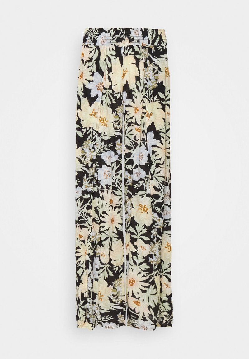 Pantalon noir à jambes larges avec une taille élastique présentant un grand motif floral en blanc, jaune clair et feuilles vertes.