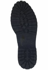 Semelle de chaussure en caoutchouc noir avec des rainures profondes, présentant des motifs circulaires et en croix pour l'adhérence. Logo "GEOX" embossé près du talon.