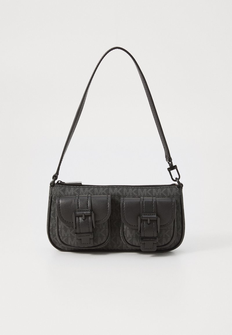 Black handbag featuring two front pockets with buckle accents, a textured fabric body, and a slim adjustable strap. Zipper closure on top.