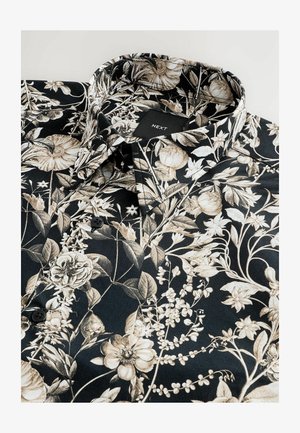 Black shirt featuring a floral pattern in beige and cream. Material appears smooth, with a classic collar and black buttons. Brand label visible.