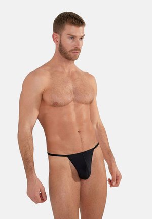 Black thong underwear made of lightweight fabric, featuring a minimal design with thin straps and a smooth texture.
