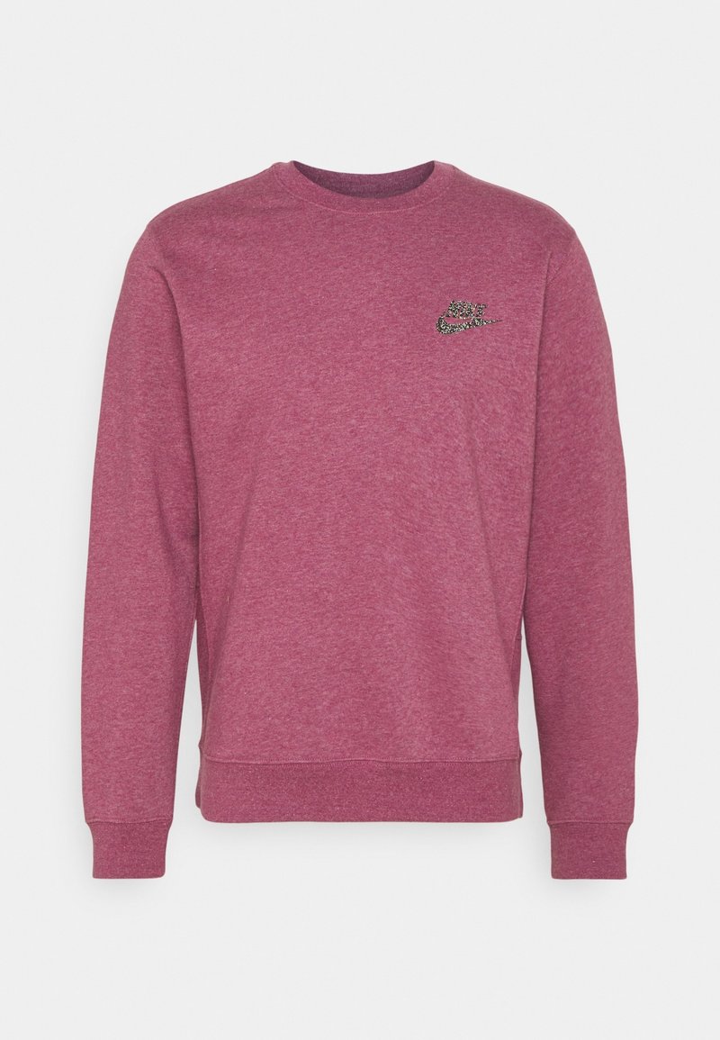 Sweat-shirt à manches longues col rond en rose foncé chiné avec petit logo Nike noir et blanc sur la poitrine gauche.