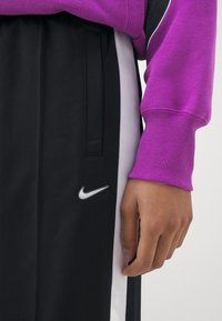 Nike Sportswear PANT - Tracksuit bottoms - black/white