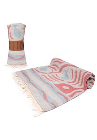 Cotton peshtemal towel with fringe, decorated with blue fish and red waves, shown rolled and partially unrolled.
