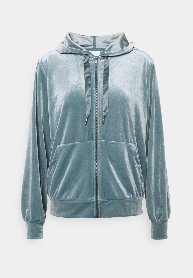 Sammetströja i dämpad teal med dragkedja framtill, snodd i huvan och två framfickor. Långa ärmar med elastiska muddar.