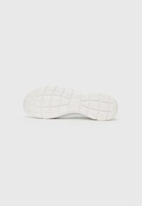 White rubber sneaker sole with textured grip pattern, featuring raised squares and a smooth finish for traction and durability.