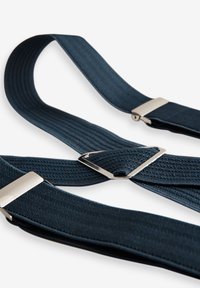 Navy blue suspender straps made of textured elastic material, featuring silver metal clips and a central triangular connector.
