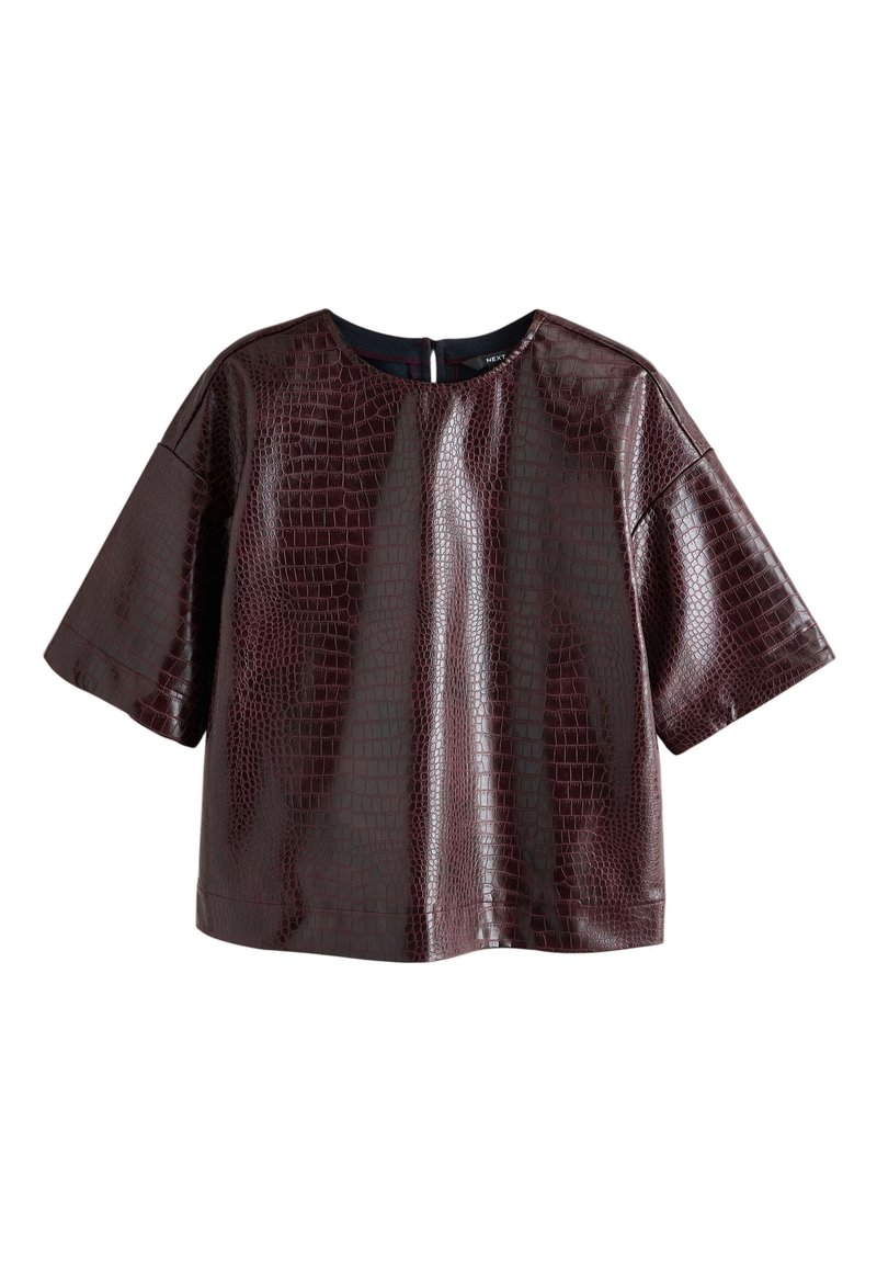 Burgundy faux leather top with a crocodile texture, short sleeves, and a round neckline, featuring a back zipper closure.
