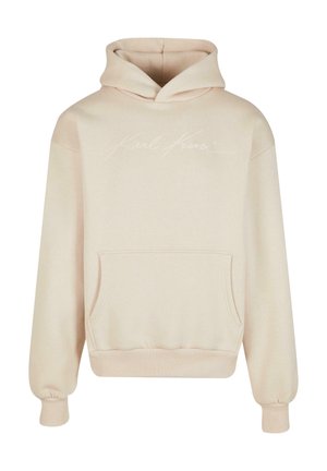 Bežs kapuces džemperis, kas izgatavots no mīkstas auduma. Iezīmēts ar priekšējo kangaroo kabatu un izšūtu "Karl Kami" logo baltā krāsā uz krūtīm.