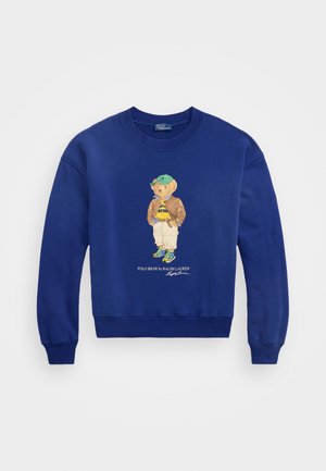 Royalblauer Sweatshirt mit gesticktem Bären, der eine Jacke und eine Mütze trägt, mit gerippten Bündchen und Saum, aus weichem Baumwollmaterial.