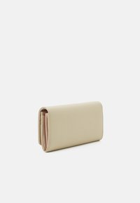 Pale beige leather wallet with a smooth texture. Features a slim rectangular shape and contrasting light interior. Minimalist design, no visible hardware.
