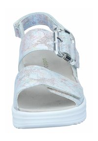 White sandal with a textured, iridescent upper, adjustable strap, and clear buckle. Features a cushioned footbed and a white sole.
